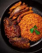 A plate of Jollof rice, banger rice, stew rice with plantain or salad and Turkey